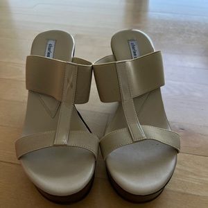 Super comfortable 4 inch wedge. Tan color goes well with everything.